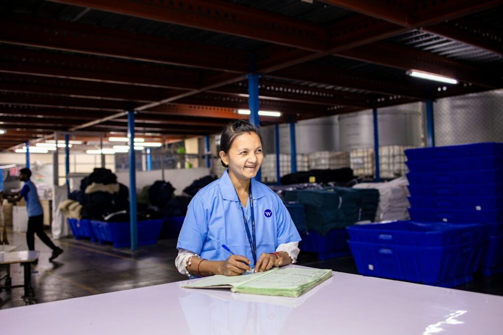 A woman works in a factory.